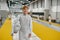 Happy smiling young fencer portrait over gym interior of martial sport school