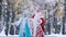 Happy Snow Maiden and Father Frost in the forest looking into the distance and greeting someone