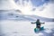 Happy Snowboarder girl with snowboard, winter at the mountain