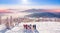 Happy snowboarders and skier having fun and posing with snowboards and ski on top mount sunrise. Aerial top view