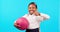 Happy, sports and child with a thumbs up on a blue background for school activities and netball. Smile, success and face