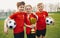 Happy Sports Soccer Team Players Holding Trophy. Winners of Youth Football Tournament