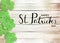 Happy St. Patrick`s Day Black Text Typography Wooden Background with Green Shamrocks clover leaf