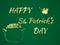 Happy St. Patrick`s Day celebration concept with Treasure of Leprechaun, Pot Full of Golden Coins, Shamrock and Glitter