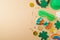 Happy St Patrick`s day holiday background with lucky charms, shamrock and  rainbow. Top view, flat lay