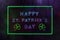 Happy St. Patrick`s Day Neon Sign in Rainy Window