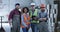 Happy staff posing in a warehouse