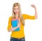 Happy student girl with book showing biceps