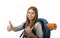 Happy student girl carrying backpack giving thumb up in travel vacation tourism concept