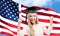 Happy student girl with diploma over american flag