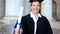 Happy student holding his diploma