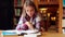 Happy student studying at desk in the library