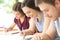 Happy student taking notes in classroom