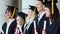 Happy students holding their tassels