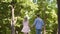 Happy students in love enjoying date in romantic mood, holding hands in park