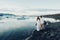 Happy stylish smiling couple walking and kissing in Iceland , on