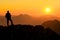 Happy success winning man standing relaxed on mountain at sunset. Border region of Tyrol, Austria and Allgaeu, Bavaria