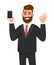 Happy successful businessman showing smart phone, mobile, cell phone in hand and gesturing okay or OK sign while winking. Good.