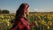 Happy summer girl laughing in sunflower field