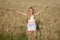 Happy summer girl in wheat field