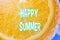 Happy Summer Greetings Emblazoned on Orange Slice. Selective focus