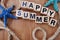Happy summer with nautical marine decoration on wooden background