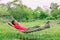 Happy summer relaxation woman sleeping in home backyard hammock relax enjoying retreat
