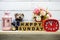 Happy Sunday wooden letter alphabet with decorate item on wooden background