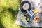 Happy sunny day at a picnic in the park. Flowers, fruits, a hat, a basket and a blanket. VINTAGE PHOTO.Copy space. Flat lay, above