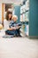 Happy Teacher And Boy Reading Book In Library