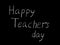 Happy Teacher& x27;s day - white inscription on a black board, handdrawn typography poster. Vector illustration