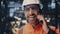 Happy technician speaking mobile phone at industrial production premises closeup