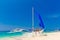 Happy teen boys on the sailboat on the tropical beach. Summer va