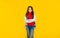 happy teen girl in casual clothes on yellow background, teeny