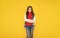 happy teen girl in casual clothes on yellow background, teeny