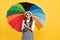 happy teen girl in glasses under colorful umbrella for rain protection in autumn season, optimist.