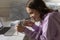 Happy teen girl playing with domesticated rat pet at home