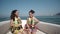 Happy teen girl on a yacht sitting with safety belts