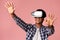 Happy teen guy enjoying virtual reality glasses experience