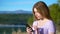 Happy teen using smart phone in a loch