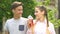 Happy teenage couple having fun together, chewing gum, drinking soda, slow-mo