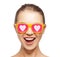 Happy teenage girl in shades with hearts