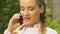 Happy teenage girl talking on phone, appointing date with boyfriend, close up