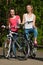 Happy teenage girls with bicycles