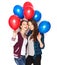 Happy teenage girls with helium balloons