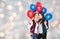 Happy teenage girls with helium balloons