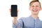 Happy teenager boy showing his smartphone blank screen isolated over white background. Joyful adolescent guy presenting a new