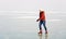 Happy teenager girl is skating on frozen Lake Bala