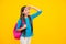 Happy teenager portrait. School teen girl in with backpack. Teenager student on isolated background. Kids learning
