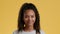 Happy teenager. Studio portrait of cute positive teen african american girl smiling and posing to camera